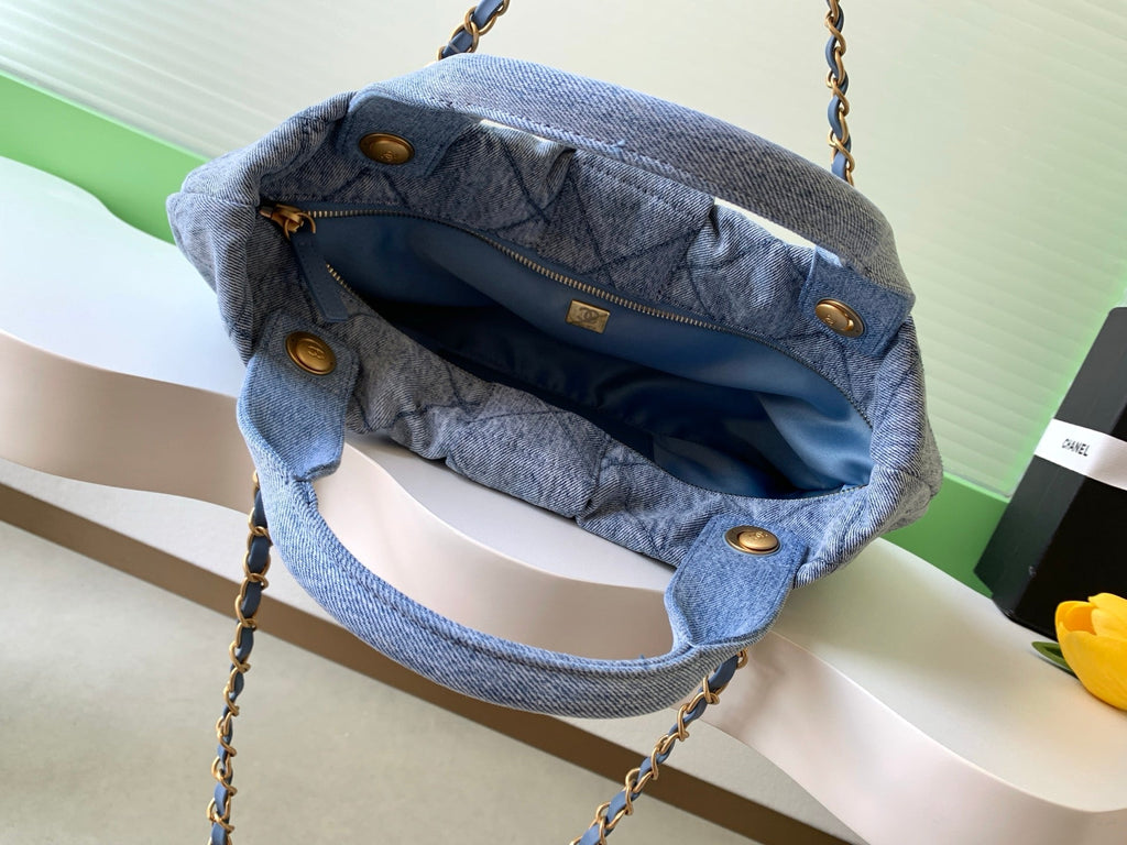 Chanel 25S Maxi Bow Bag 38 in Blue Denim with Gold Hardware